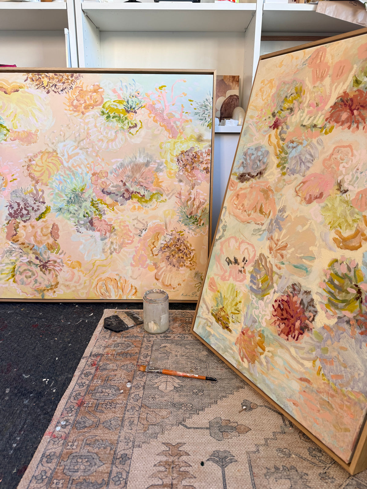 Two peach and pink original FLOAT paintings displayed in Prudence De Marchi's studio.