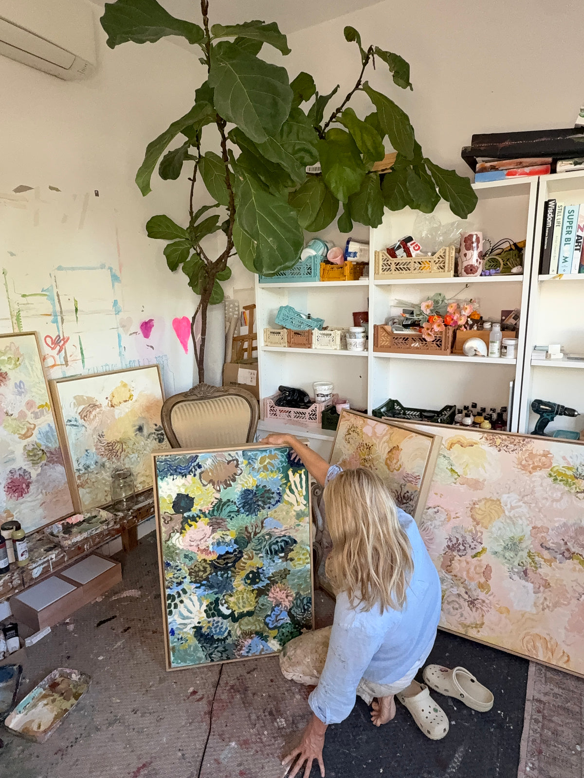 Prudence De Marchi beside Exploring the Depths and other FLOAT paintings in her daylight studio.