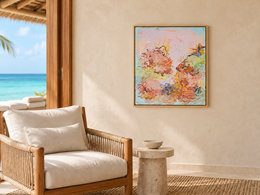 Treasures by Prudence De Marchi, a pink and aqua abstract painting beside a woven armchair in a coastal interior.